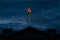 The US flag against a stormy skycape