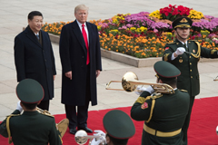  China’s President Xi Jinping (back L) and US President Donald Trump (back 2nd L) attend a welcome ceremony at the Great Hall of the People in Beijing on November 9, 2017.  AFP/Getty Images