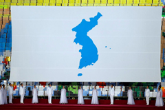 A huge unification flag is seen during the mass games performance of "The Glorious Country" at May Day Stadium in Pyongyang, North Korea, Wednesday, Sept. 19, 2018. 