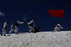 Chinese soldiers patrol the border with India