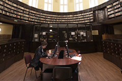 Researcher alone in library