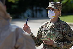 Female military leader wearing Covid-19 protective mask