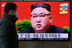 A man watches a television screen showing news footage of North Korean leader Kim Jong Un attending the 8th Congress of the ruling Workers' Party, held in Pyongyang, at a railway station in Seoul on Jan. 6. Jung Yeon-je/AFP via Getty Images