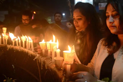 Indian mourners take part in a candle-lit vigil following the car bombing © AFP