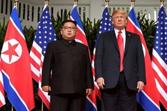 Donald Trump and Kim Jong Un pose for the cameras at their first summit on June 12, 2018 in Singapore. (Photo: AFP/SAUL LOEB) Read more at https://www.channelnewsasia.com/news/world/trump-s--great-chemistry--with-kim-jong-un-put-to-test-at-summit-11281222