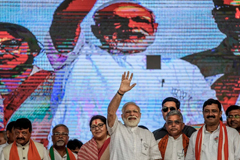  Indian Prime Minister Narendra Modi waves at the public rally in Kolkata, India, on April 3. (Atul Loke/Getty Images) 