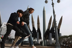  South Koreans walk past replicas of North Korean and South Korean missiles on February 28, 2019 in Seoul. North Korea tested a short-range missile on May 3, 2019. Chung Sung-Jun/Getty Images 