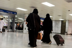  Saudi women roll at the departure hall of the Jeddah Airport on Aug. 6. Source: AFP via Getty Images 