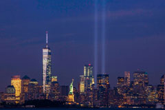 View of NYC with lights shining up from where Twin Towers used to stand to honor 9/11