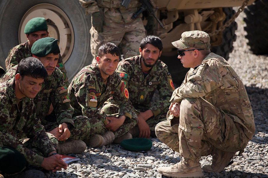 U.S. Soldier in Afghanistan Caption: A U.S. Soldier speaks to a group of Afghan National Army Soldiers.